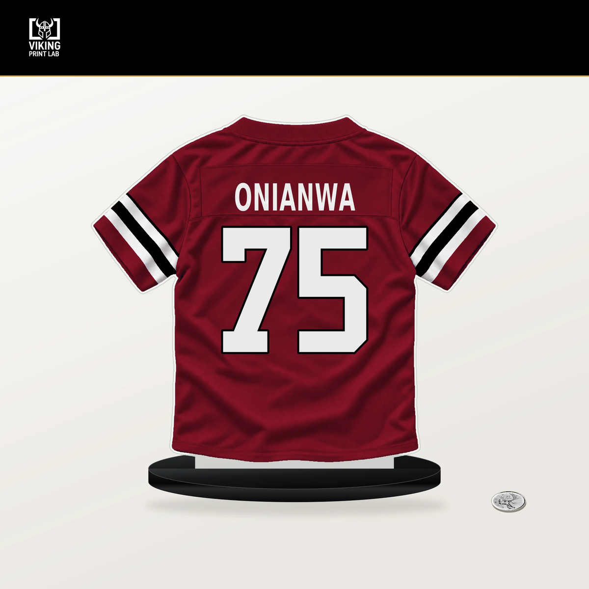Ethan Onianwa number 75 Atlanta Falcons jersey stand with included black base.