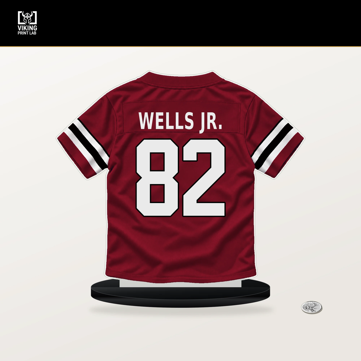 Antwane Wells Jr. number 82 Atlanta Falcons jersey stand with included black base.