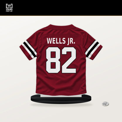 Antwane Wells Jr. number 82 Atlanta Falcons jersey stand with included black base.