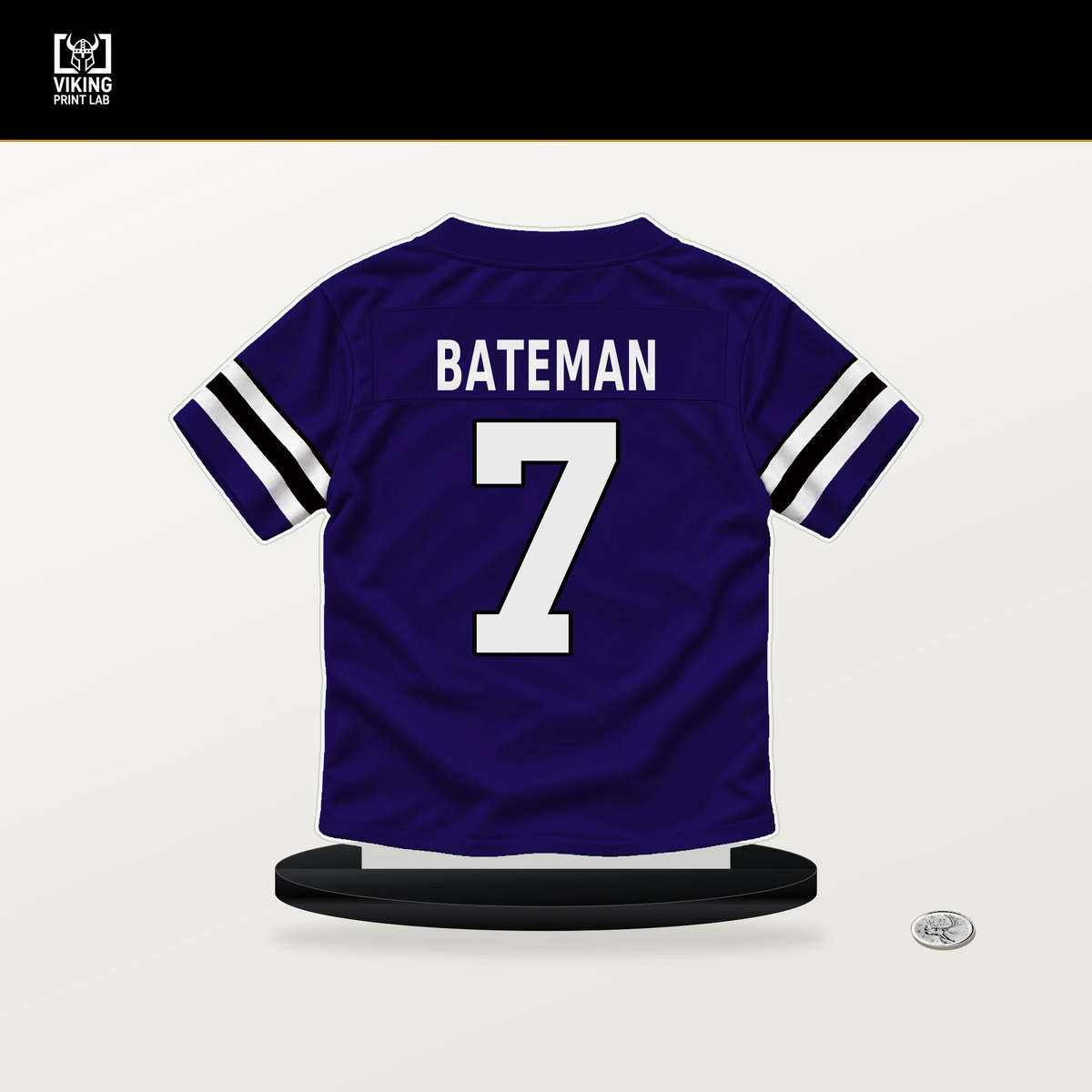 Rashod Bateman number 7 Baltimore Ravens jersey stand with included black base.
