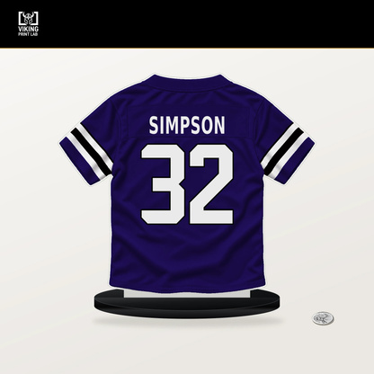 Trenton Simpson number 32 Baltimore Ravens jersey stand with included black base.
