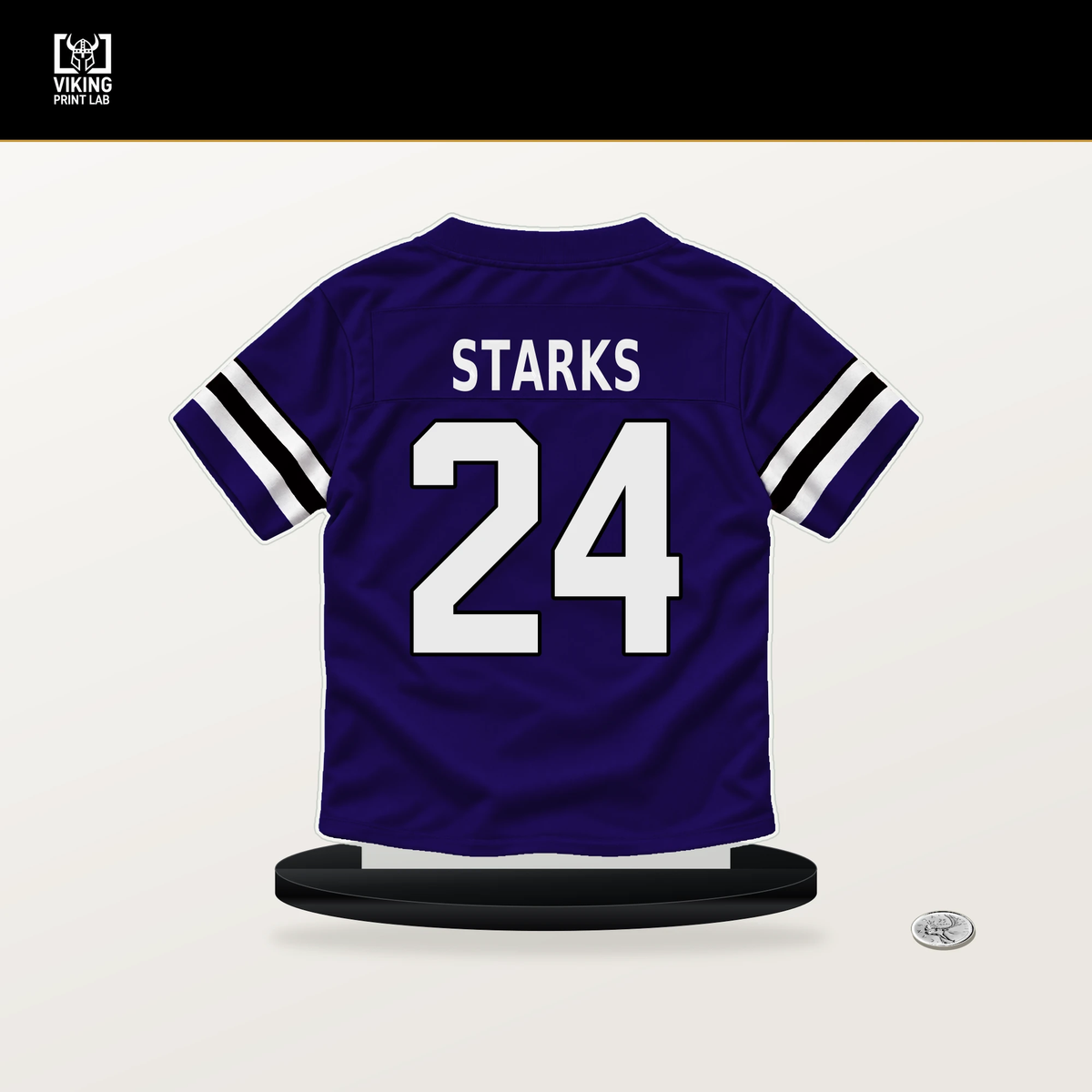 Malaki Starks number 24 Baltimore Ravens jersey stand with included black base.