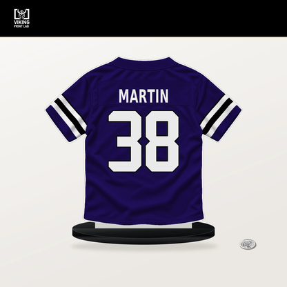 Keyon Martin number 38 Baltimore Ravens jersey stand with included black base.
