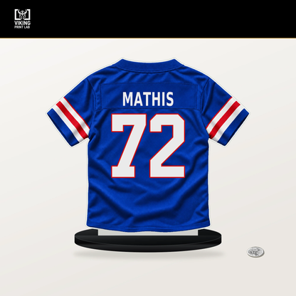 Phidarian Mathis number 72 Buffalo Bills jersey stand with included black base.