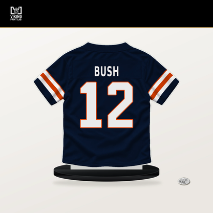 Devin Bush number 12 Chicago Bears jersey stand with included black base.