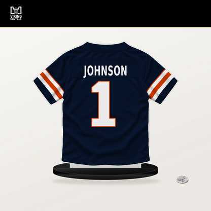 Jaylon Johnson number 1 Chicago Bears jersey stand with included black base.