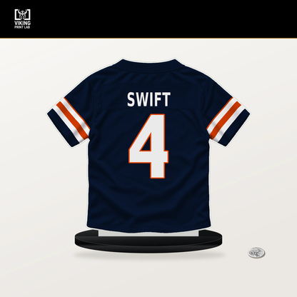 D'Andre Swift number 4 Chicago Bears jersey stand with included black base.