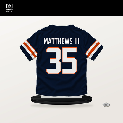 Wayne Matthews III number 35 Chicago Bears jersey stand with included black base.