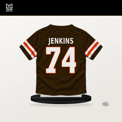 Elgton Jenkins number 74 Cleveland Browns jersey stand with included black base.