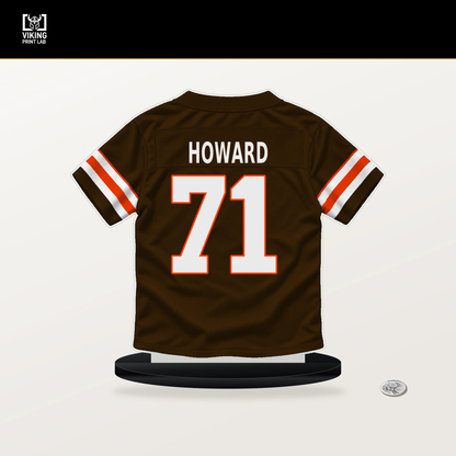 Tytus Howard number 71 Cleveland Browns jersey stand with included black base.