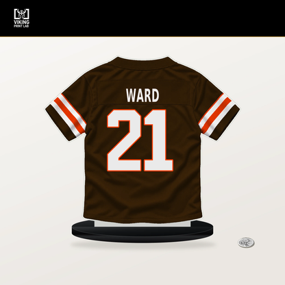 Denzel Ward number 21 Cleveland Browns jersey stand with included black base.