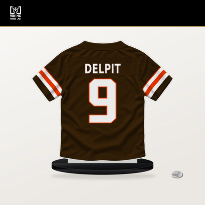 Grant Delpit number 9 Cleveland Browns jersey stand with included black base.