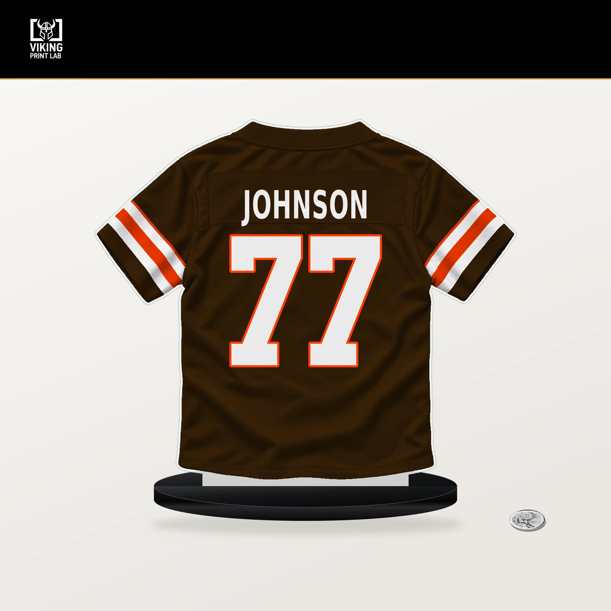 Zion Johnson number 77 Cleveland Browns jersey stand with included black base.