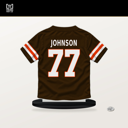Zion Johnson number 77 Cleveland Browns jersey stand with included black base.