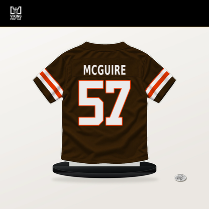 Isaiah McGuire number 57 Cleveland Browns jersey stand with included black base.