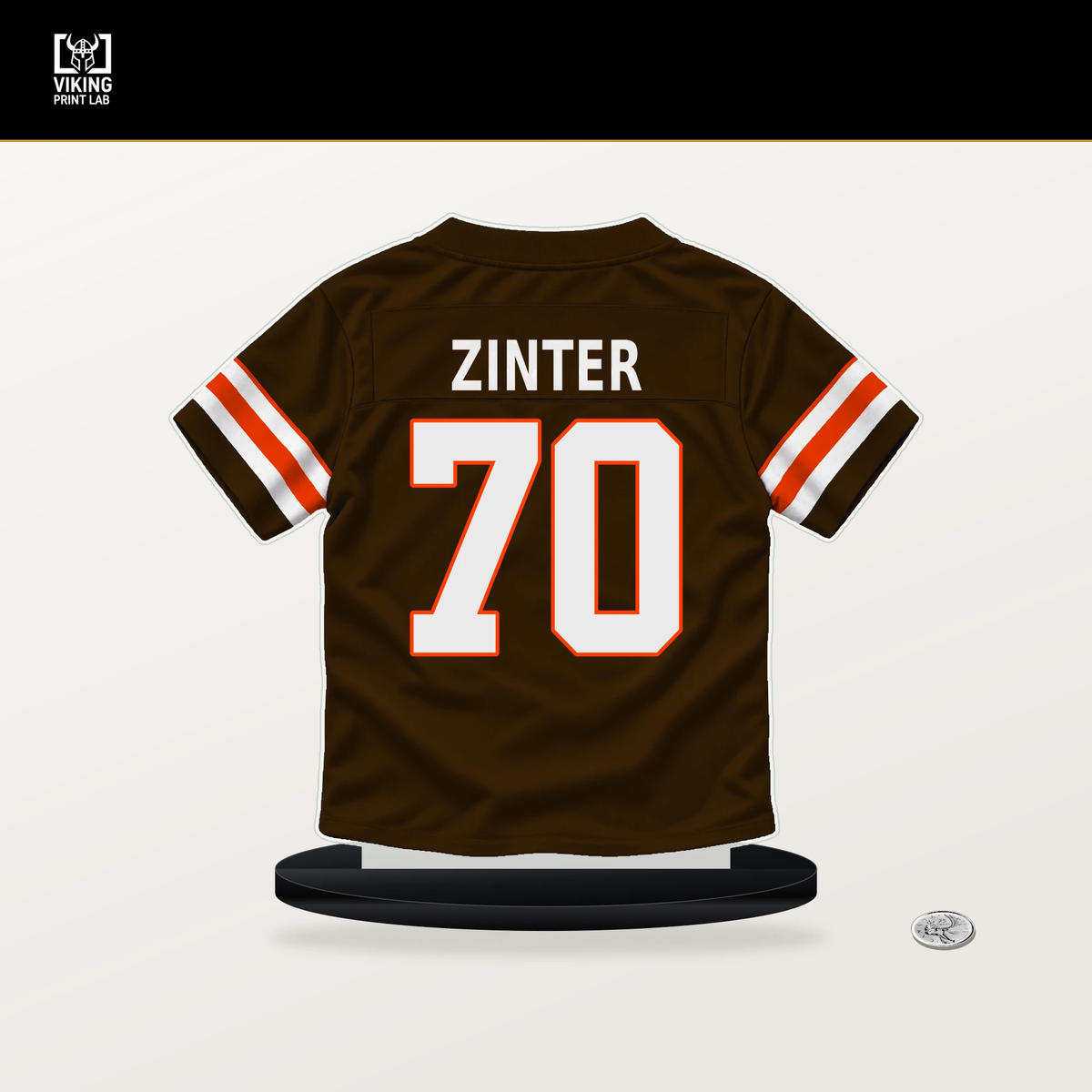 Zak Zinter number 70 Cleveland Browns jersey stand with included black base.