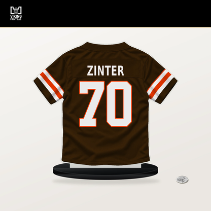 Zak Zinter number 70 Cleveland Browns jersey stand with included black base.