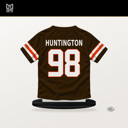 Adin Huntington number 98 Cleveland Browns jersey stand with included black base.