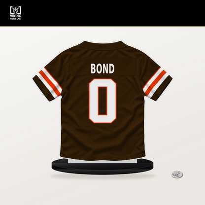 Isaiah Bond number 0 Cleveland Browns jersey stand with included black base.