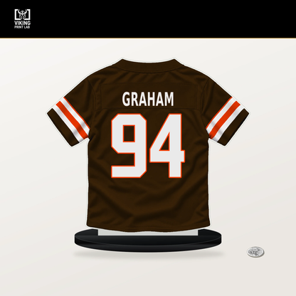 Mason Graham number 94 Cleveland Browns jersey stand with included black base.