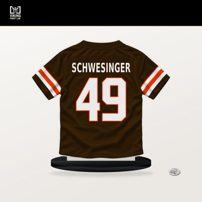 Carson Schwesinger number 49 Cleveland Browns jersey stand with included black base.