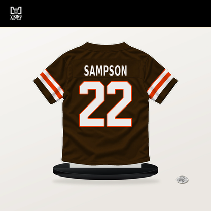 Dylan Sampson number 22 Cleveland Browns jersey stand with included black base.