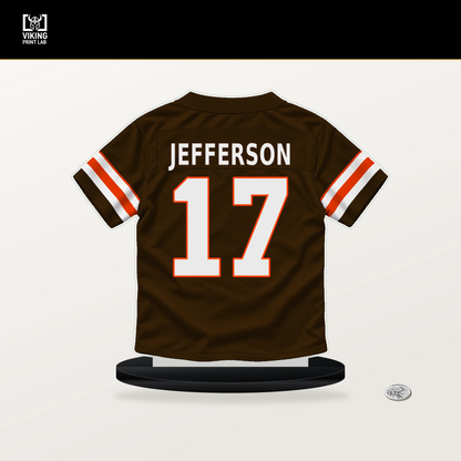 Justin Jefferson number 17 Cleveland Browns jersey stand with included black base.