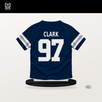 Kenny Clark number 97 Dallas Cowboys jersey stand with included black base.