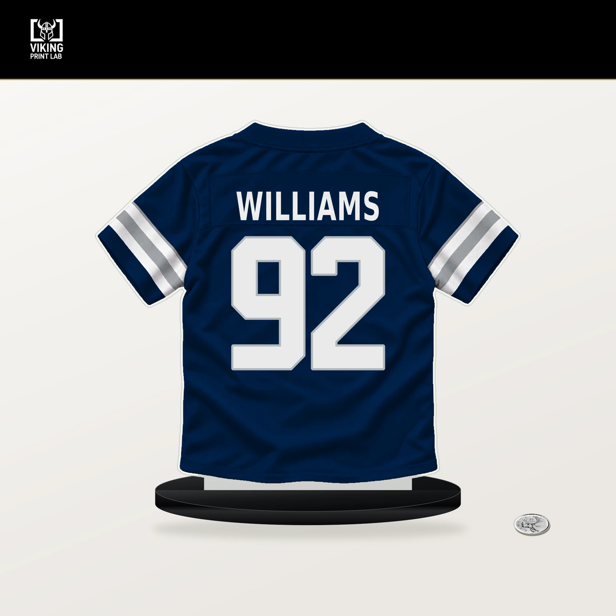 Quinnen Williams number 92 Dallas Cowboys jersey stand with included black base.