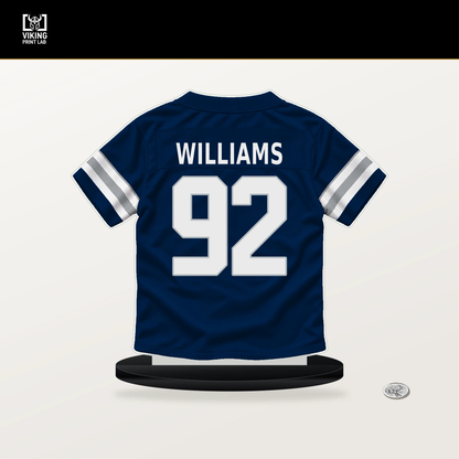 Quinnen Williams number 92 Dallas Cowboys jersey stand with included black base.