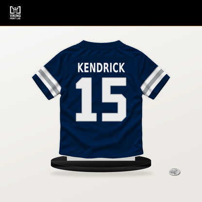 Derion Kendrick number 15 Dallas Cowboys jersey stand with included black base.