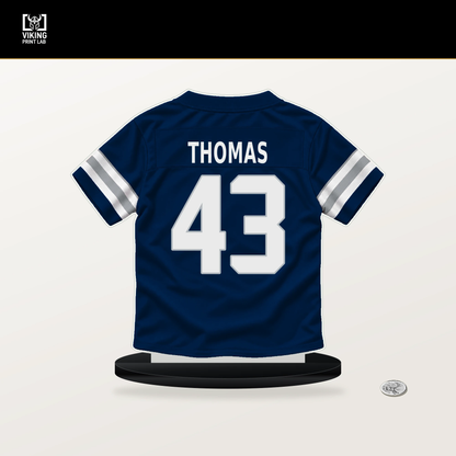 Juanyeh Thomas number 43 Dallas Cowboys jersey stand with included black base.