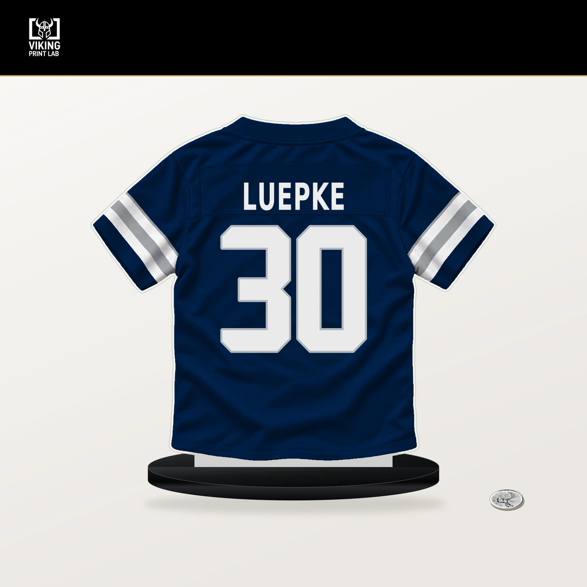 Hunter Luepke number 30 Dallas Cowboys jersey stand with included black base.