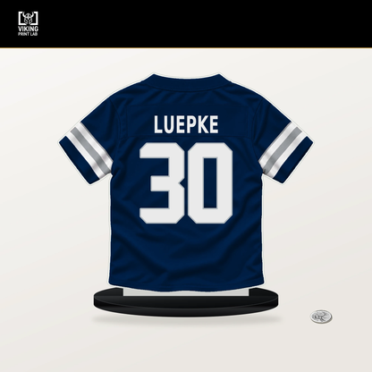 Hunter Luepke number 30 Dallas Cowboys jersey stand with included black base.