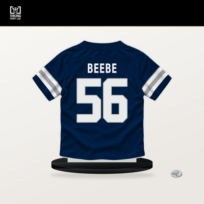 Cooper Beebe number 56 Dallas Cowboys jersey stand with included black base.