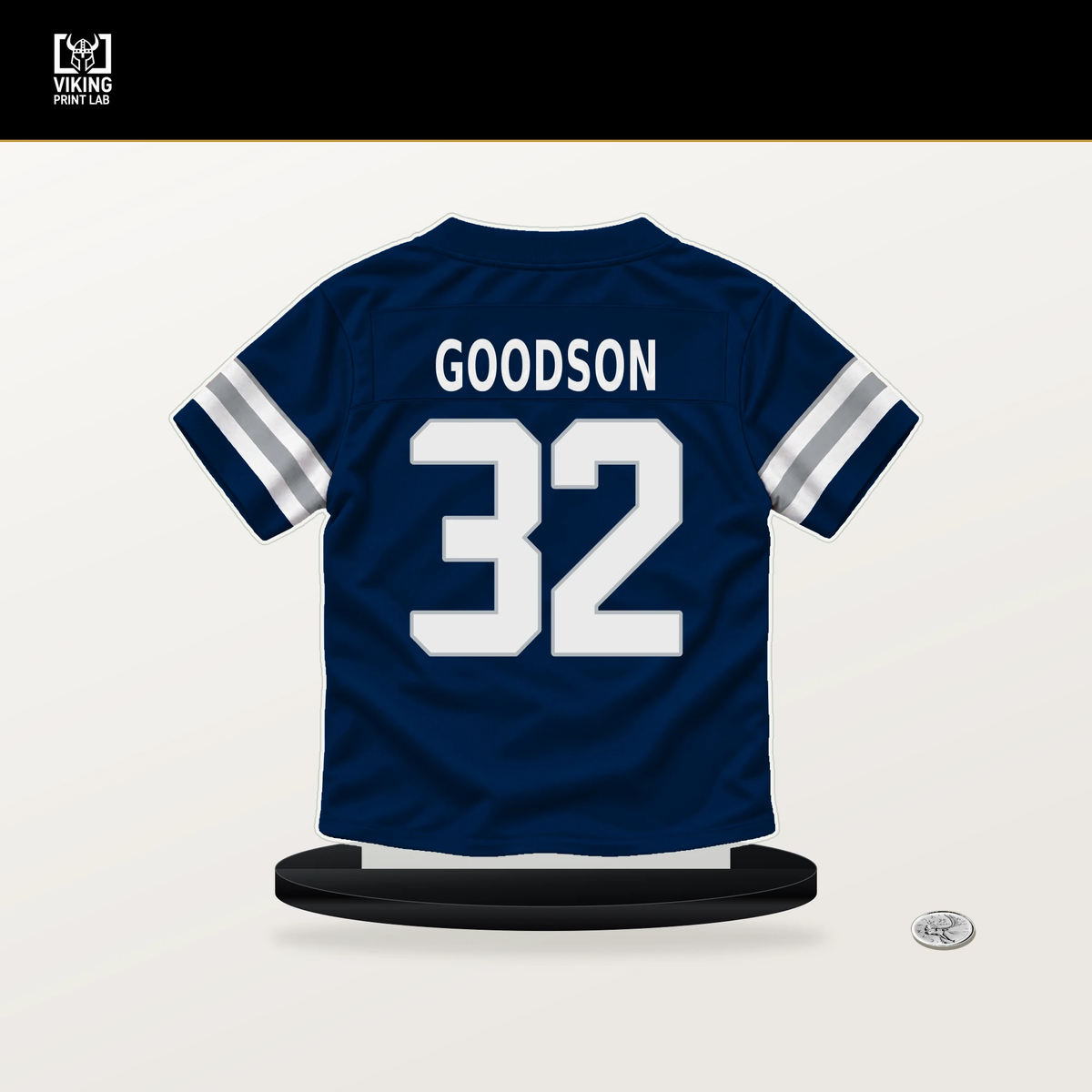 Tyler Goodson number 32 Dallas Cowboys jersey stand with included black base.