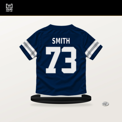 Tyler Smith number 73 Dallas Cowboys jersey stand with included black base.