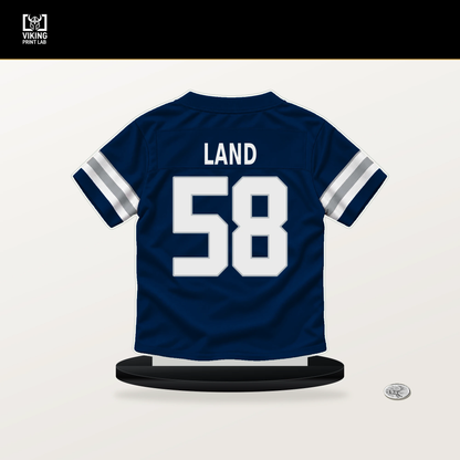 Isaiah Land number 58 Dallas Cowboys jersey stand with included black base.