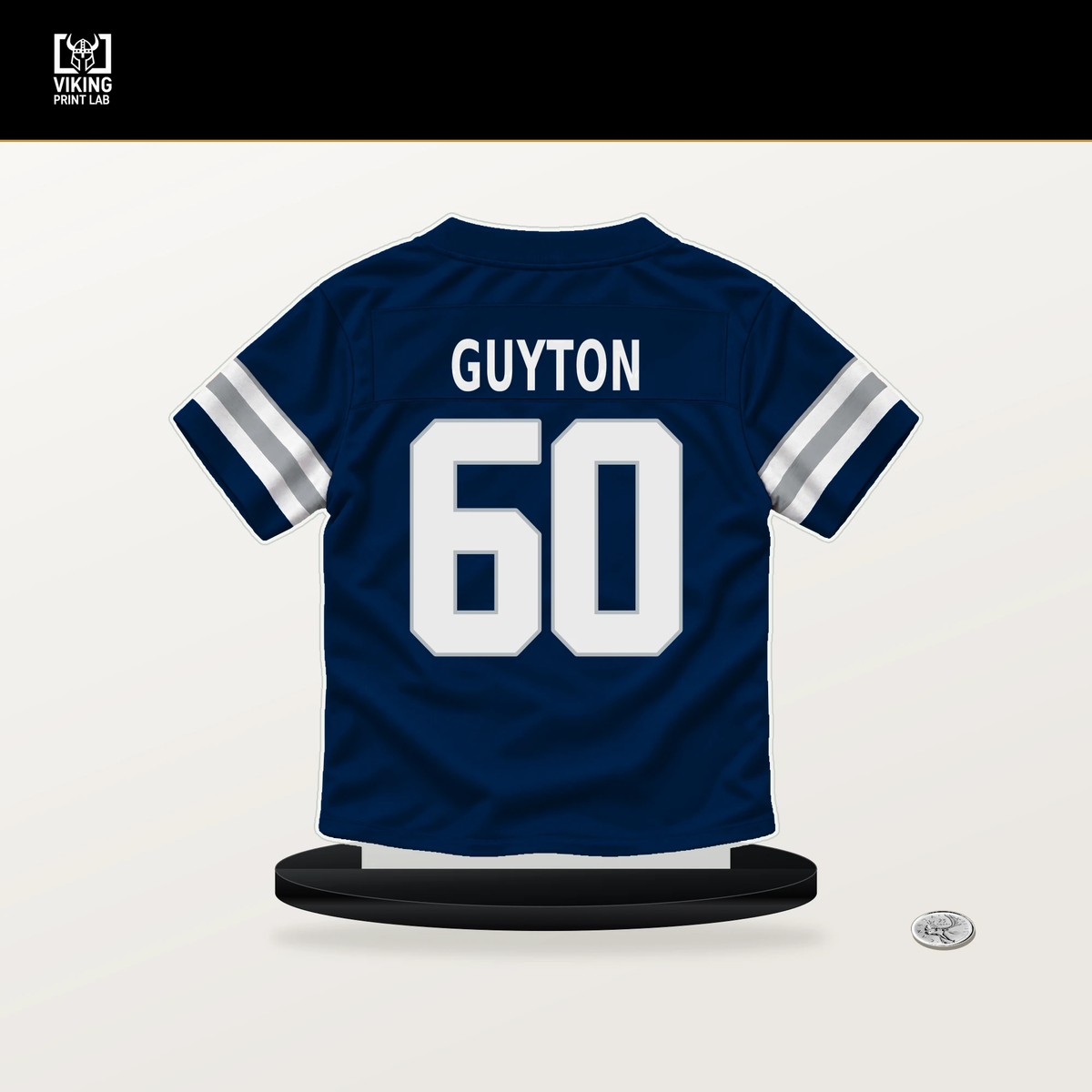 Tyler Guyton number 60 Dallas Cowboys jersey stand with included black base.