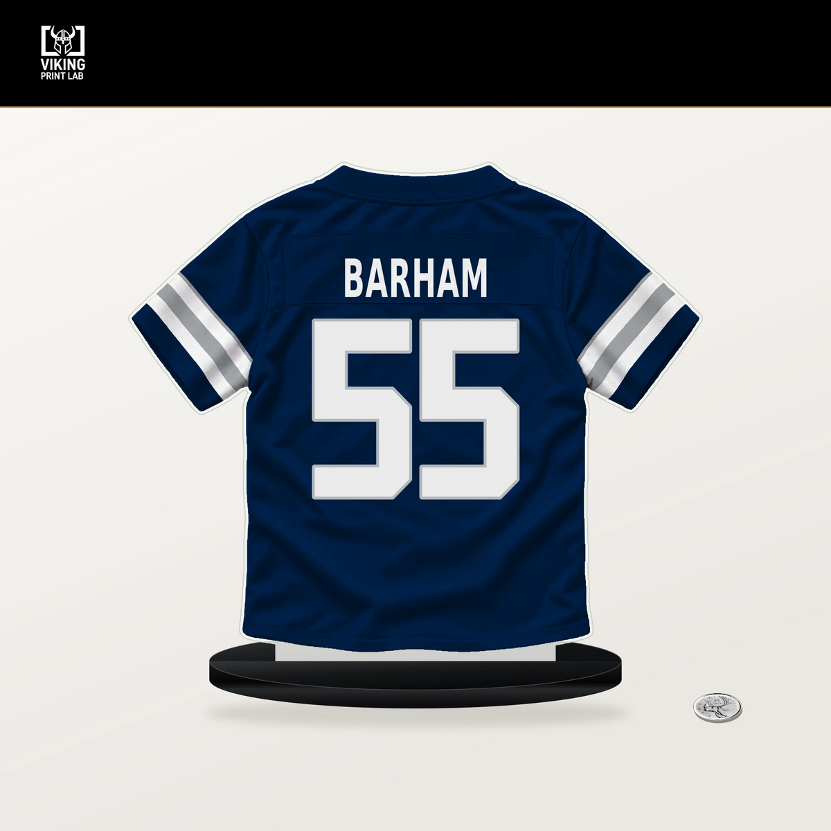 Jaishawn Barham number 55 Dallas Cowboys jersey stand with included black base.