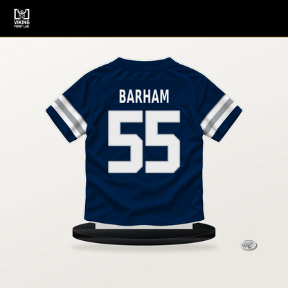 Jaishawn Barham number 55 Dallas Cowboys jersey stand with included black base.