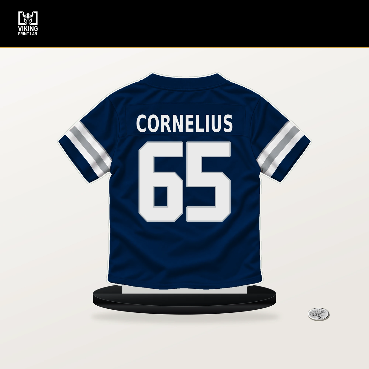 Ajani Cornelius number 65 Dallas Cowboys jersey stand with included black base.