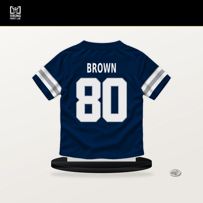 Camden Brown number 80 Dallas Cowboys jersey stand with included black base.