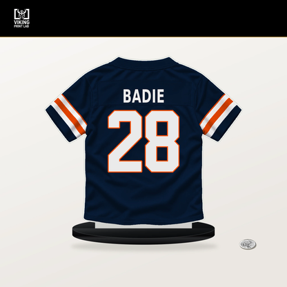 Tyler Badie number 28 Denver Broncos jersey stand with included black base.