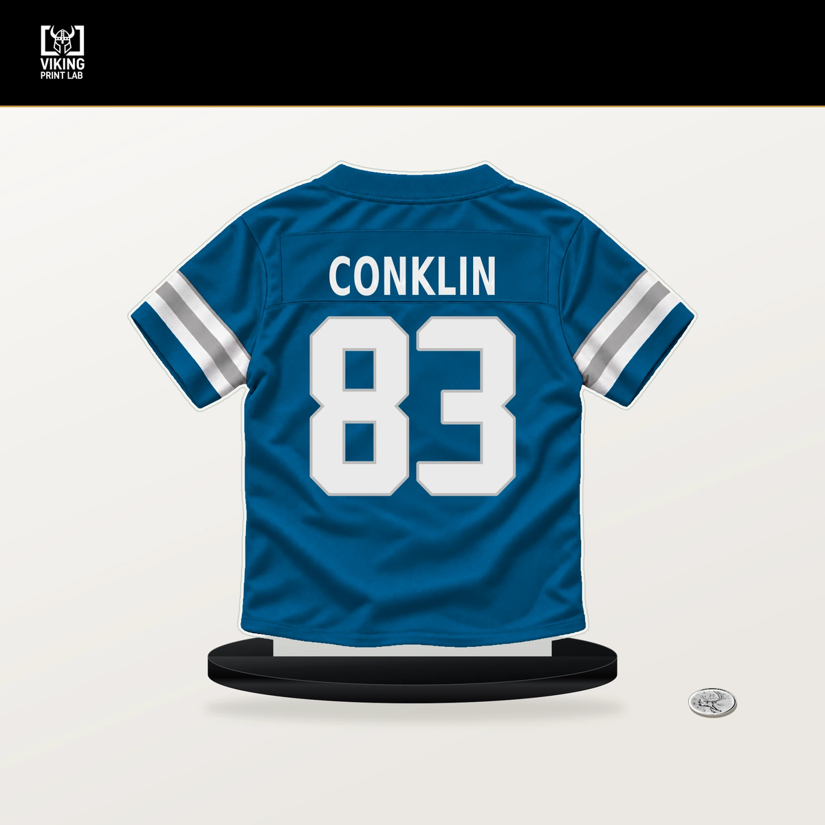 Tyler Conklin number 83 Detroit Lions jersey stand with included black base.