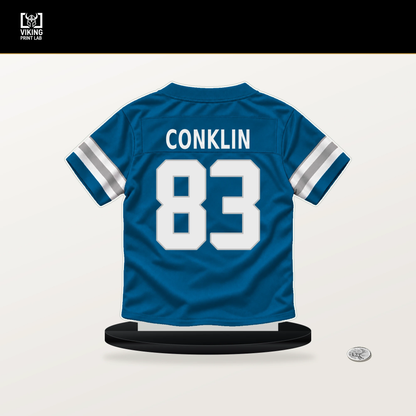 Tyler Conklin number 83 Detroit Lions jersey stand with included black base.