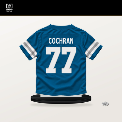 Devin Cochran number 77 Detroit Lions jersey stand with included black base.