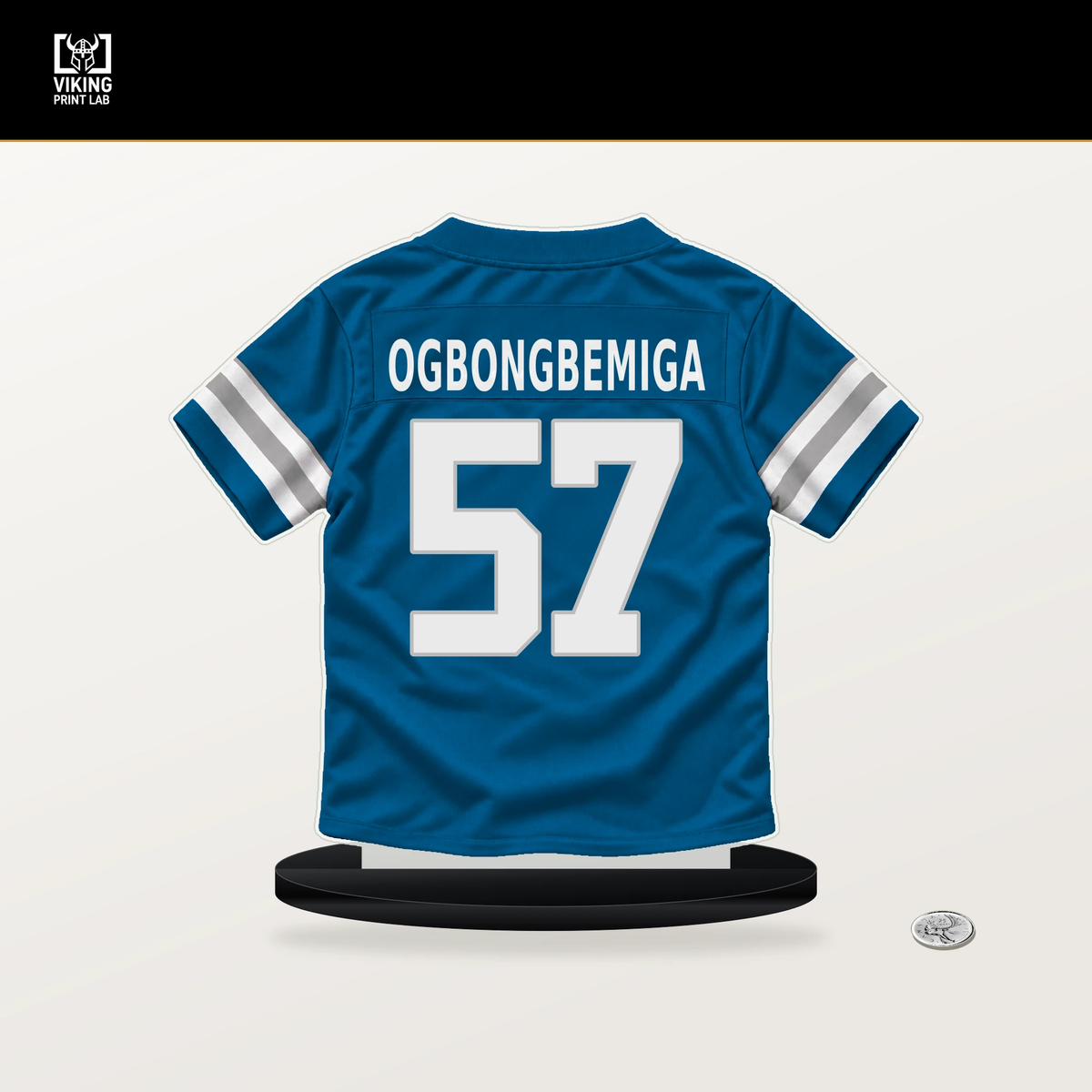 Amen Ogbongbemiga number 57 Detroit Lions jersey stand with included black base.