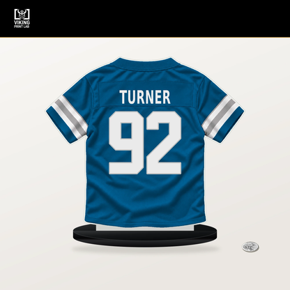 Payton Turner number 92 Detroit Lions jersey stand with included black base.