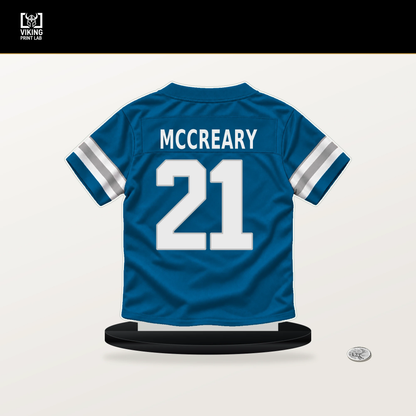 Roger McCreary number 21 Detroit Lions jersey stand with included black base.